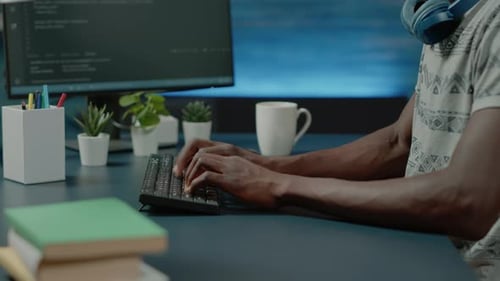 Close Up of Black Hands Coding Server Interface with Binary Codes