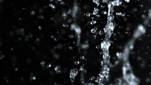 Abstract Water Droplets Splashing on Black Background