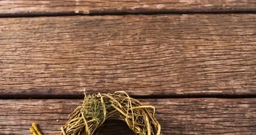 Handmade Rustic Wreath on Wooden Surface