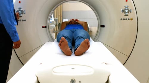 A patient is loaded into an mri machine