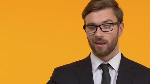Man Talking and Gesturing in Suit
