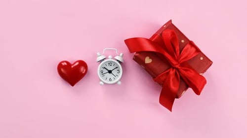 Gift, Clock and Heart on Pink Background