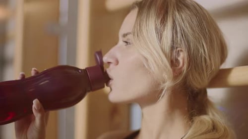 Woman Drinking Water After Workout, Close Up
