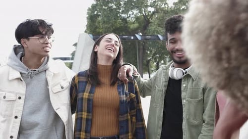 Four Friends Smiling Together in Urban Setting