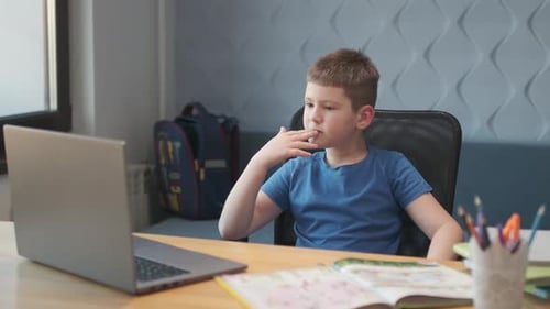 Boy Attending Online Class on Laptop at Home