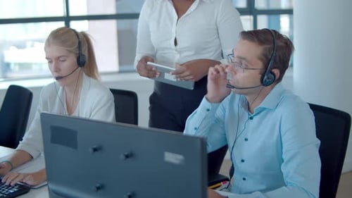 Young African American Manager Helping Call Center Operators