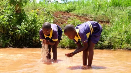 Kids at Muddy Stream, Drinking Water