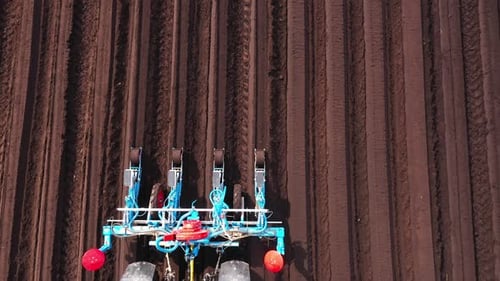 Tractor with Seeder in the Field