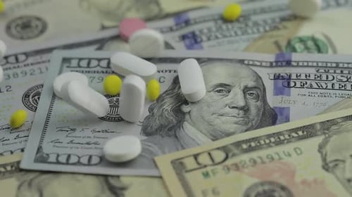 Pills Falling on Dollar Banknotes, Expensive Medication, Pharmaceutical Business