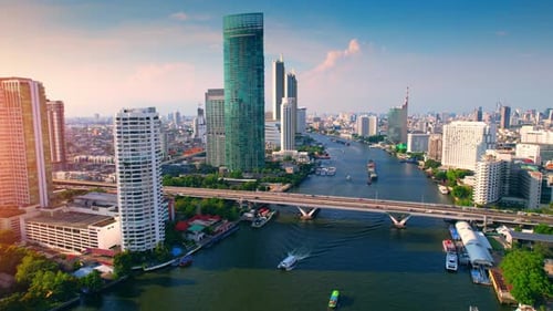 4K UHD : Aerial view over the Chao Phraya River and Buildings of Bangkok