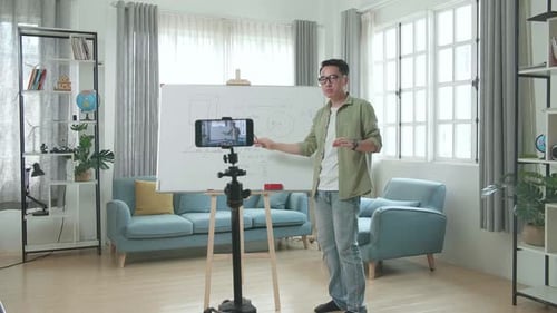 Man Teaching Math Class with Tablet at Home