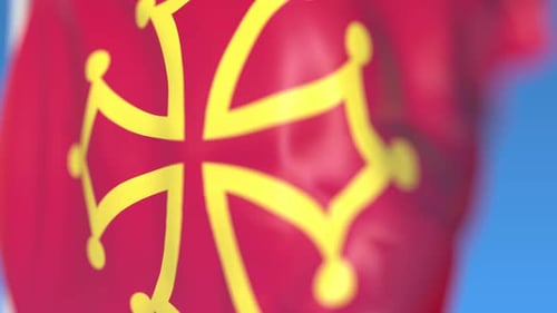 Vibrant Occitan Flag Waving Seamlessly Against a Blue Sky