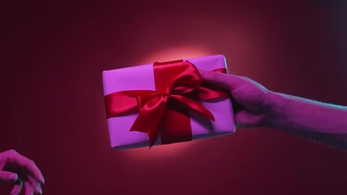 Present Being Passed Between Two People