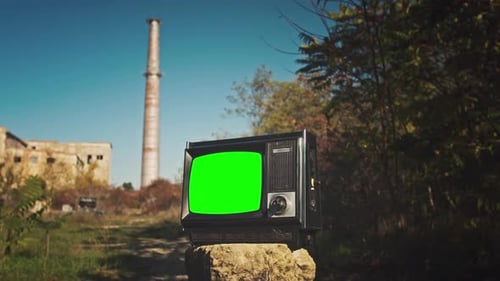 Vintage Television with Green Screen in Abandoned Setting