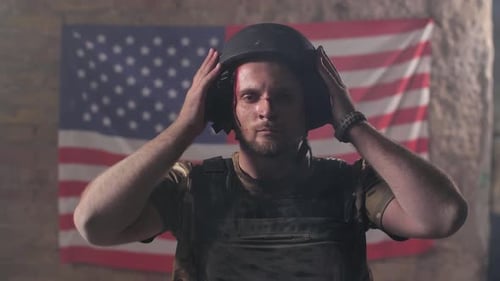 Wounded Soldier Taking Off Military Helmet