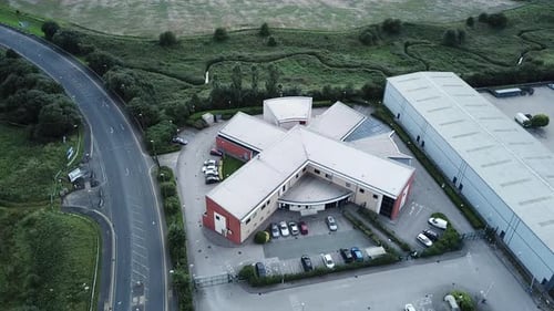 Aerial View of Modern Building Surrounded by Greenery