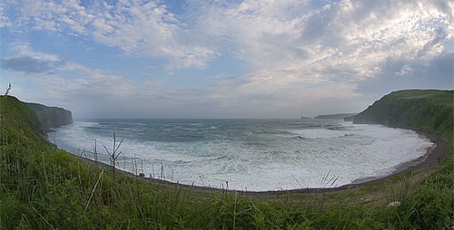 Scenic Coastline with Waves Crashing on Beach