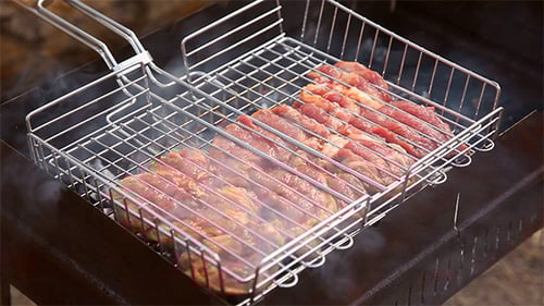 Raw Meat on Barbecue Grill with Smoke