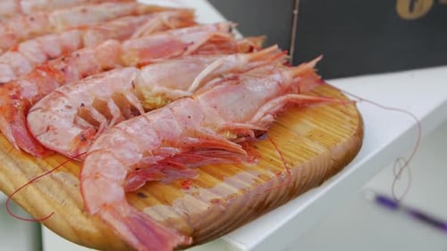 Fresh Raw Shrimp Displayed on Cutting Board