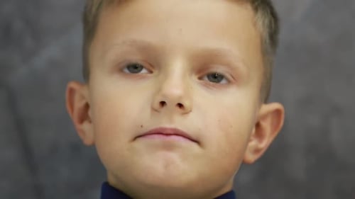 Portrait of Funny Little Boy Talking to Camera