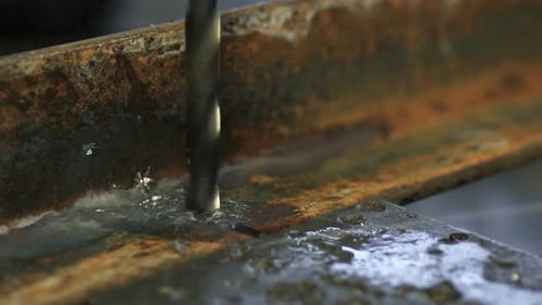 Drill Bit Drilling into Metal Material