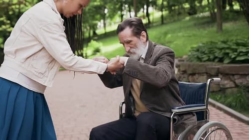 Girl with Trendy Hairstyle Helping to Get up from Wheelchair Her Handsome Joyful Carefree Senior