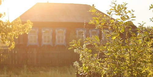 Traditional Wooden House at Sunrise