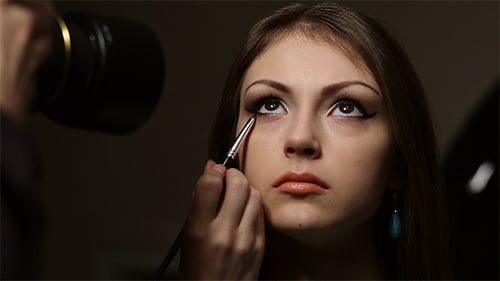 Elegant Young Woman Getting Eye Makeup Applied