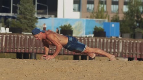 Sports Exercises Outdoors Young Fit Man Doing Push Ups Off the Stone at the Beach