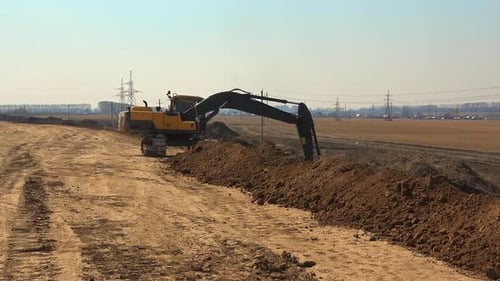 Excavator Digging at Construction Site During Daytime