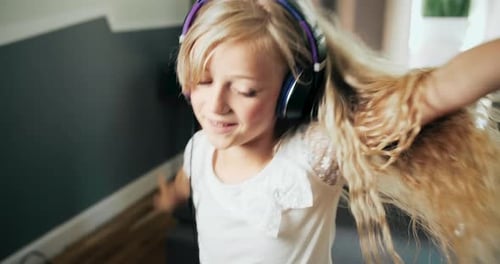 Girl Listening to Music and Dancing Indoors