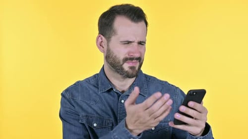 Man Crying While Using Smartphone