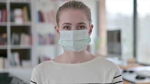 Young Adult Woman Wearing a Medical Mask