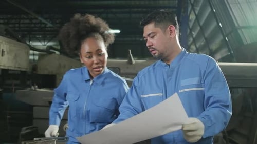 Professional workers teams work in the metalwork manufacturing factory.