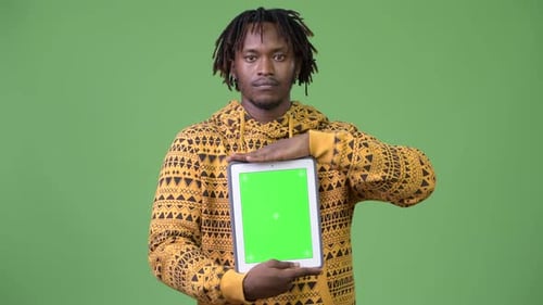 Man Holding Tablet with Chroma Key Background