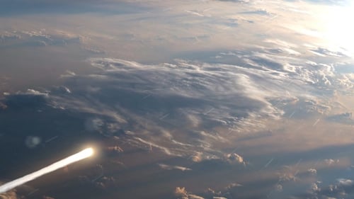 Burning Meteor Trail Streaking Across Sky