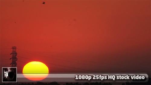 Glowing Sun Rises in Golden Hour Sky