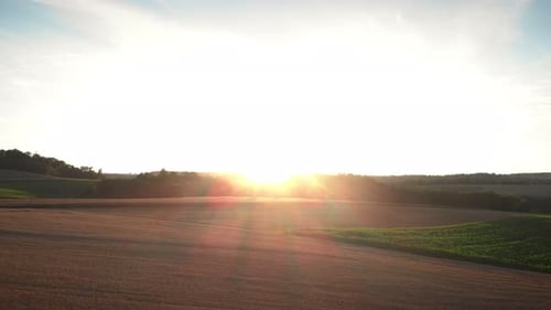 Sunrise Over Rolling Farmland Hills Aerial View