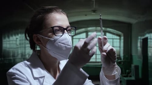 Doctor Prepares Syringe in Spooky Lab Setting
