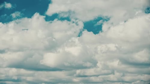 Cloudy Sky With Fluffy Clouds