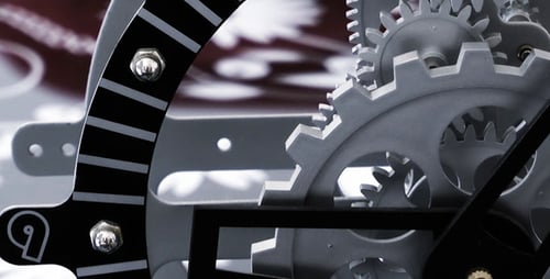Clock Gears Turning in Close Up