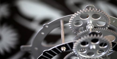 Clock Gears Turning Close Up Inside Silver Frame