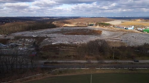 Aerial drone view of stack of different types of large mountain garbage pile