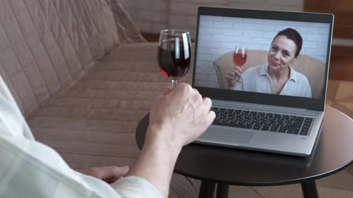 Adults Connect Via Video Call Over Wine