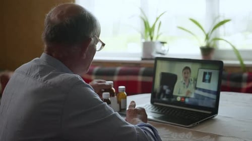 Senior Man Telehealth Conference with Doctor
