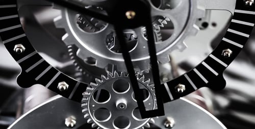 Silver Clock with Gears Turning in Close Up