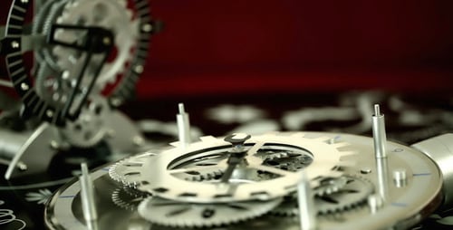 Rotating Metallic Gears and Cogs Close Up