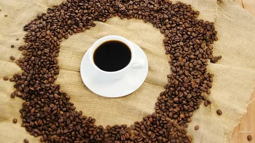 Coffee Cup and Beans on Burlap
