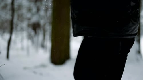 Workout in Nature in Winter Forest Man is Lifting Log Training Muscles of Arms and Endurance