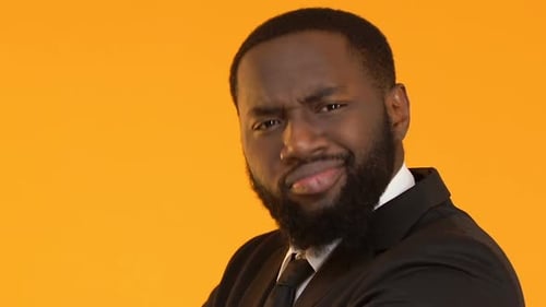 Bearded Man in Suit Looking at Camera